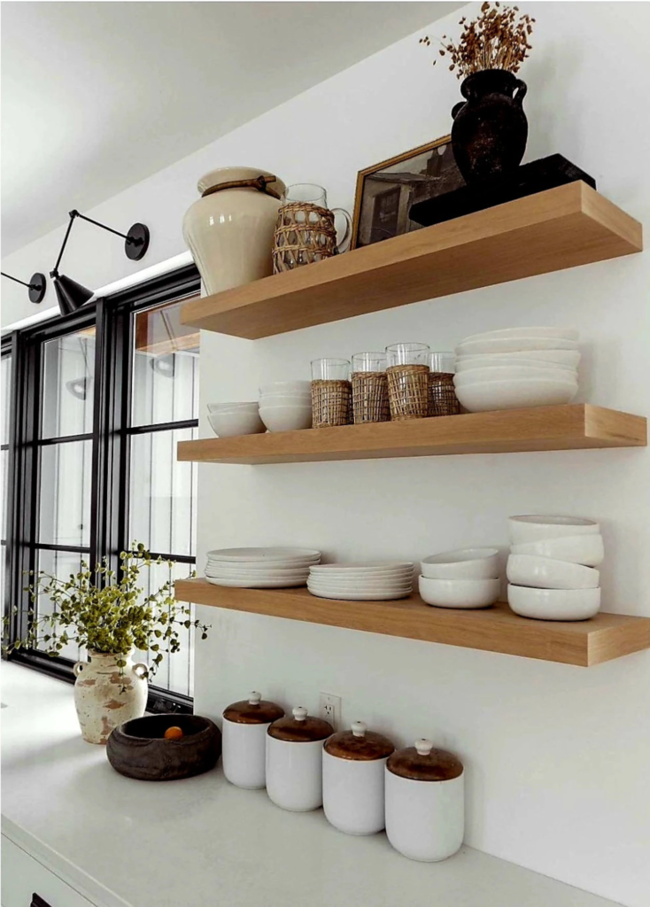 Custom oak floating shelf mounted on a wall for indoor plant displays